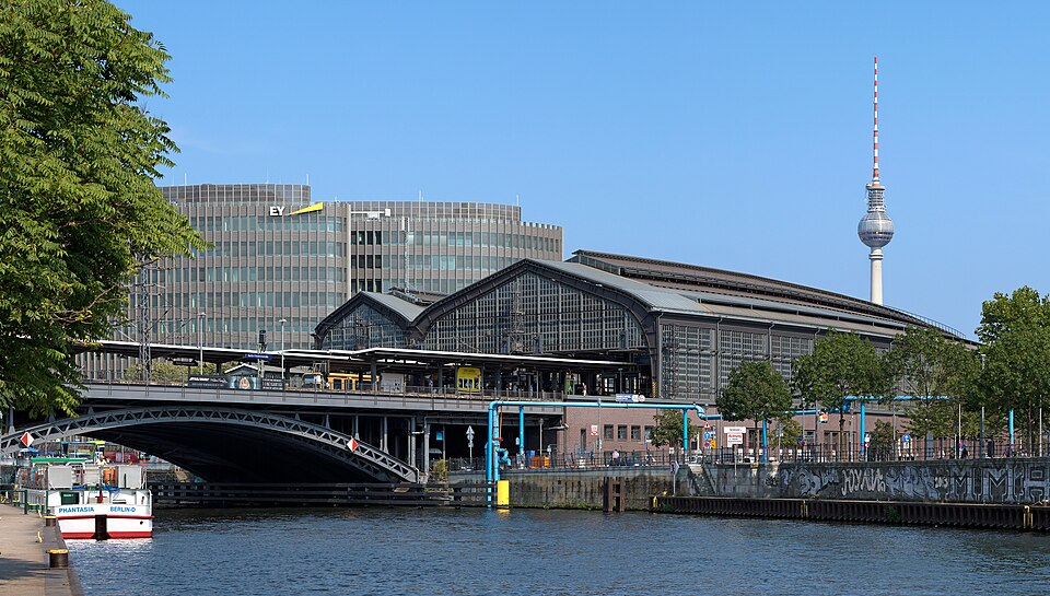 The Friedrichstraße station in Berlin , detail view from Schiffbauerdamm over the Spree with Spreedreieck -building and the Fernsehturm Berlin near…