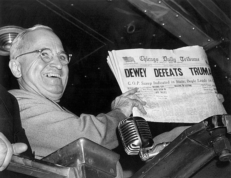 Harry S. Truman holding the Chicago Daily Tribune with the erroneous headline, " Dewey Defeats Truman ", at Union Station in St. Louis, Missouri, on…
