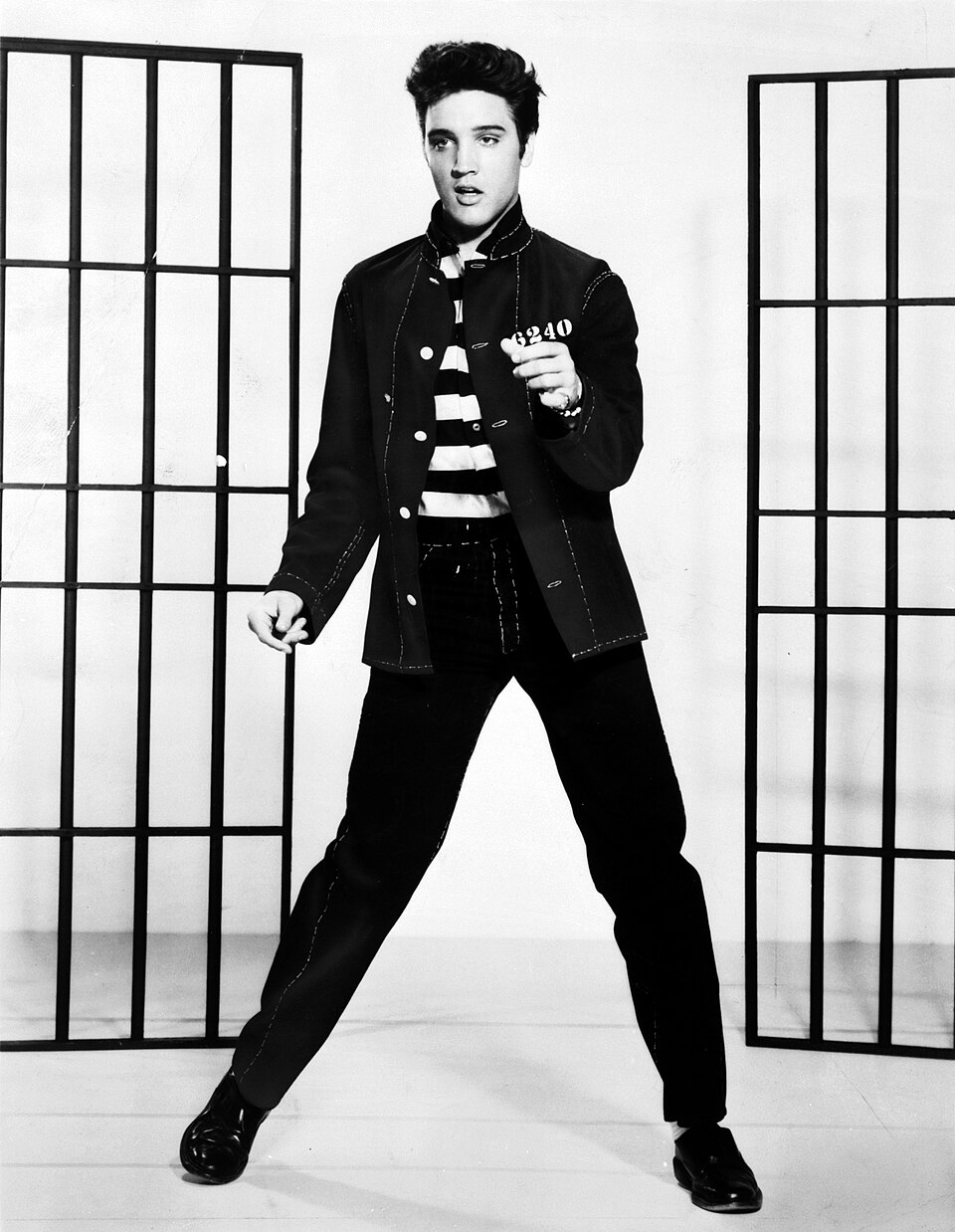 A photograph promoting the film Jailhouse Rock depicts singer Elvis Presley .