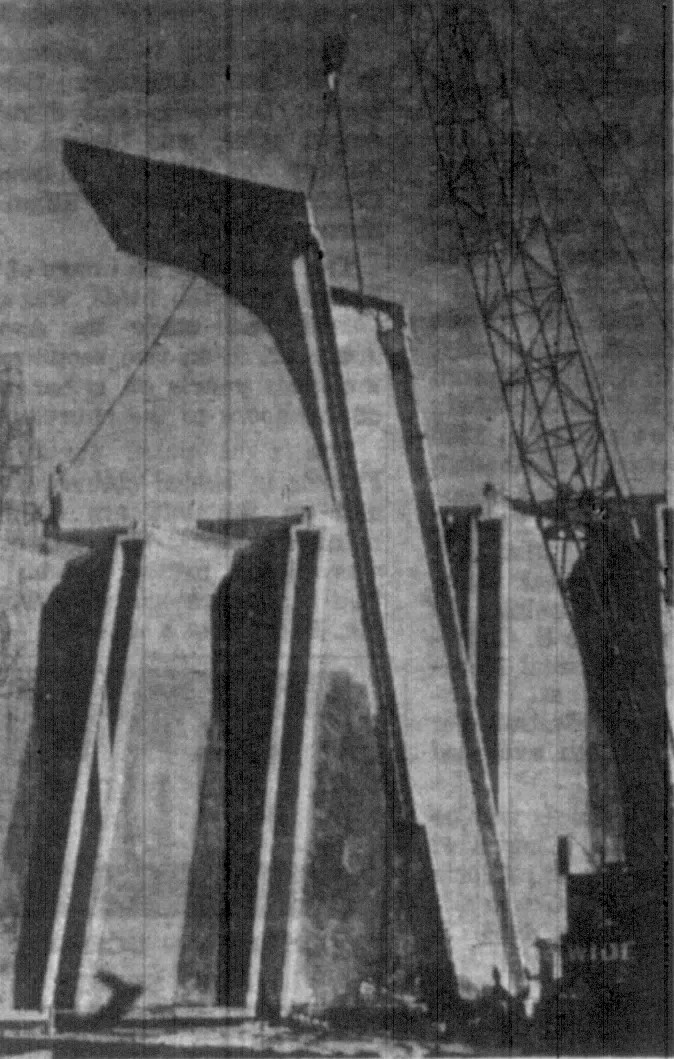 A 14-foot-wide, 33,000 pound concrete panel, 40 feet high, is swung into place at the sanctuary building of Englewood Methodist Church in Englewood,…