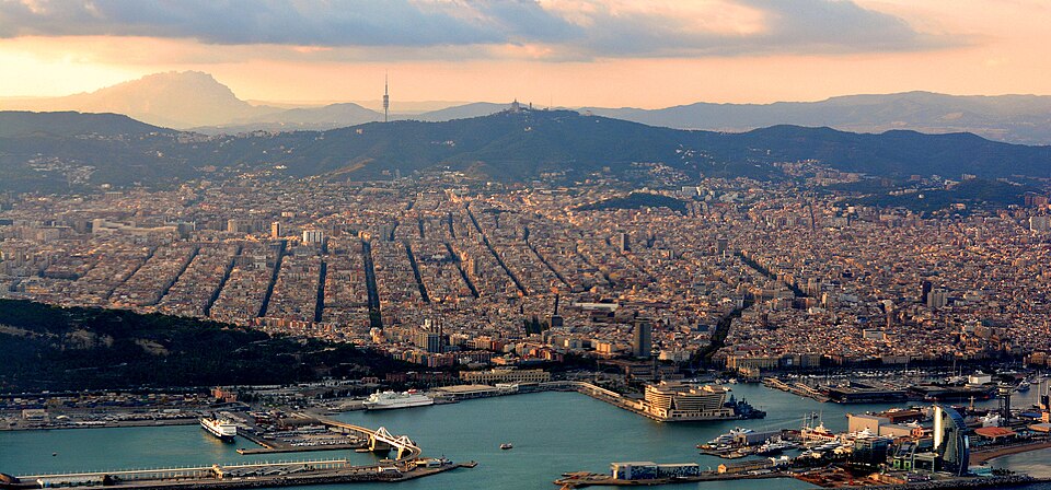 With part of the Port of Barcelona in the foreground and Montserrat Mountain at top left