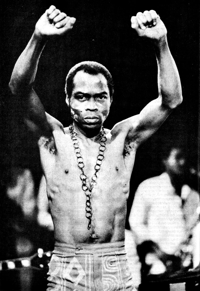 Fela Kuti photographed on stage. Distributed as a promotional photo in 1986.