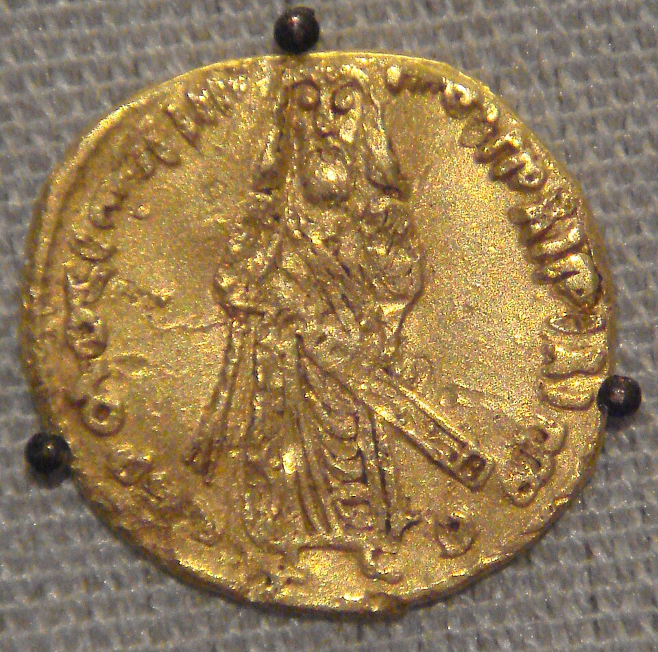 Umayyad Caliph 'Abd al-Malik: 'Caliphal Image solidus' or Standing Caliph solidus struck from 74-77 AH. Based on Byzantine numismatic traditions. Note that,…