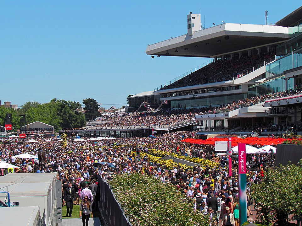 A view of the stands at w:Flemington Racecourse during the 2013 Melbourne Cup .