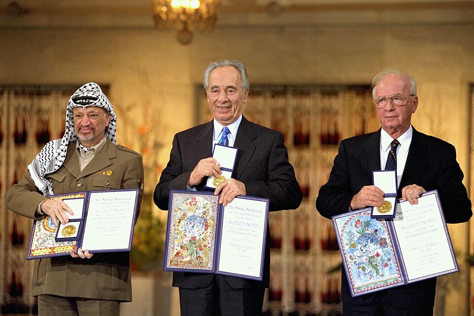 The Nobel Peace Prize laureates for 1994 in Oslo. From left to right: PLO Chairman Yasser Arafat, Israeli Foreign Minister Shimon Peres, Israeli Prime…