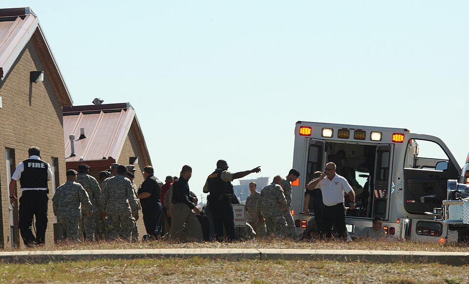 First responders prepare the wounded for transport in waiting ambulances near Fort Hood's Soldier Readiness Processing Center Nov. 5. (U.S. Army…