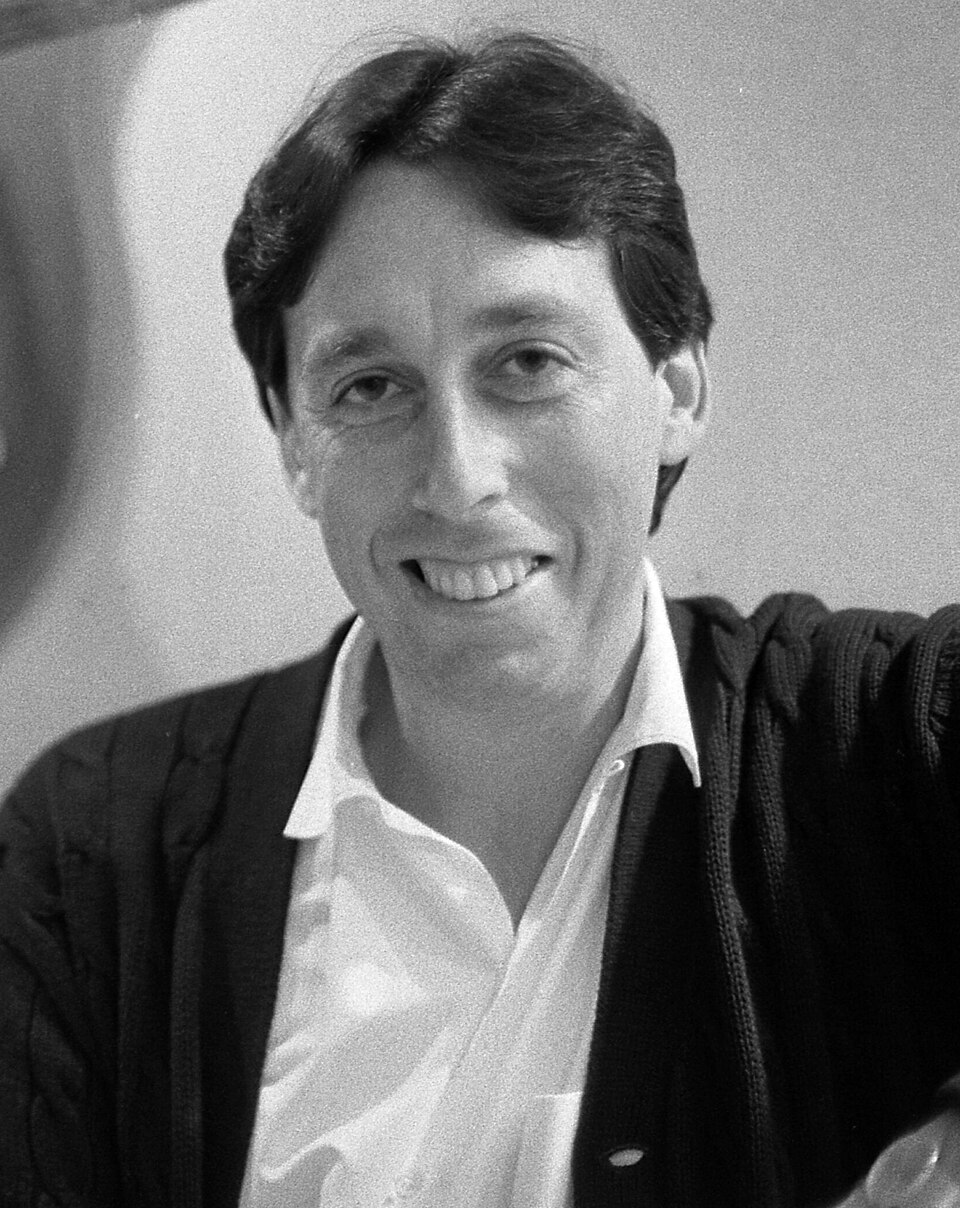 Producer-director Ivan Reitman posing with head of Terror Dog creature from Ghostbusters movie