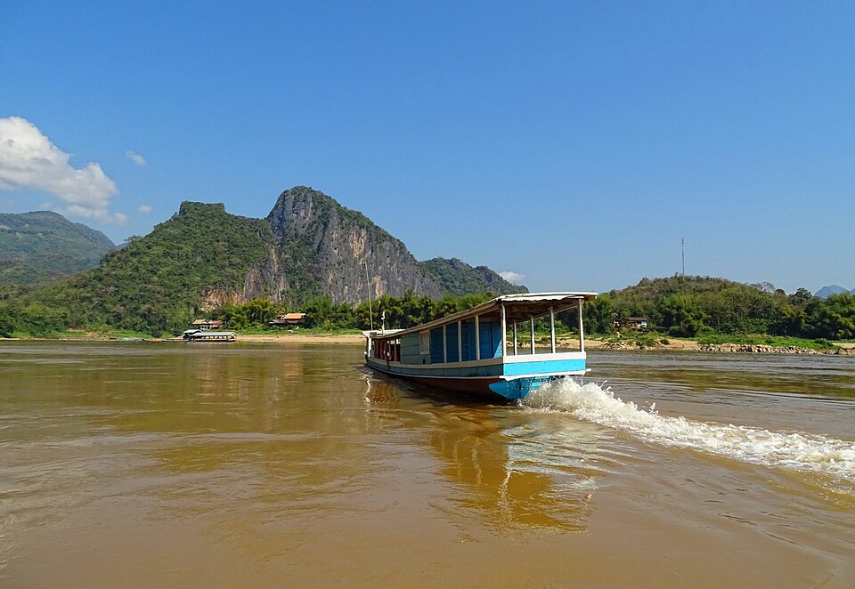 The Mekong River upstream from Luang Prabang, Laos. Boats like this one ferry passengers between Luang Prabang and the Pak Ou Caves.