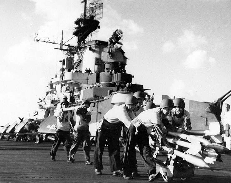 Carrier Raids on Formosa, October 1944. Crewmen on USS Hancock (CV-19) move rockets to planes, while preparing for strikes on Formosa, 12 October 1944.