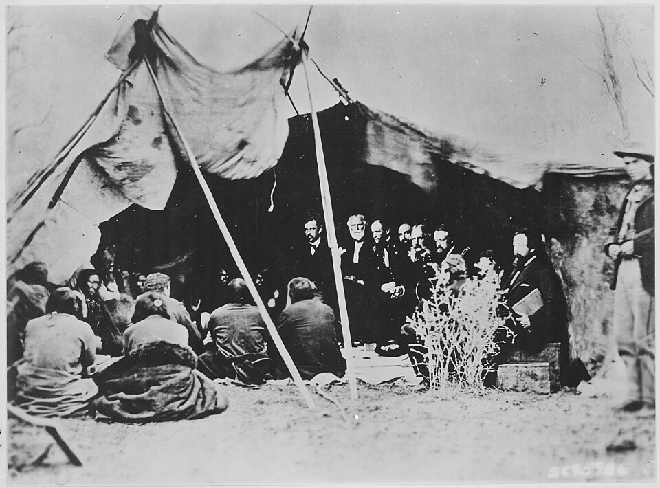 Scope and content: This item shows the signing of a peace treaty by William T. Sherman and the Sioux at Fort Laramie, Wyoming.