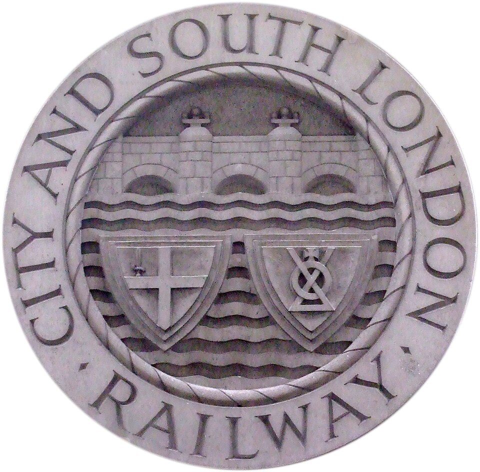 Badge of the City and South London Railway on the reserve side of the pedestal of the monument to James Henry Greathead in the City of London . The badge…