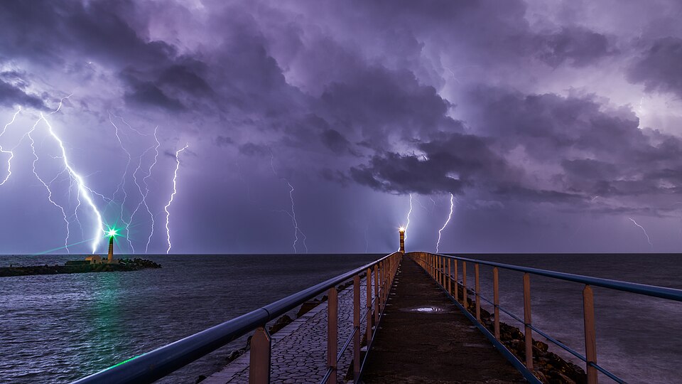Lightning during an overnight storm at the port and lighthouse in Port-la-Nouvelle in the Aude department in southern France .