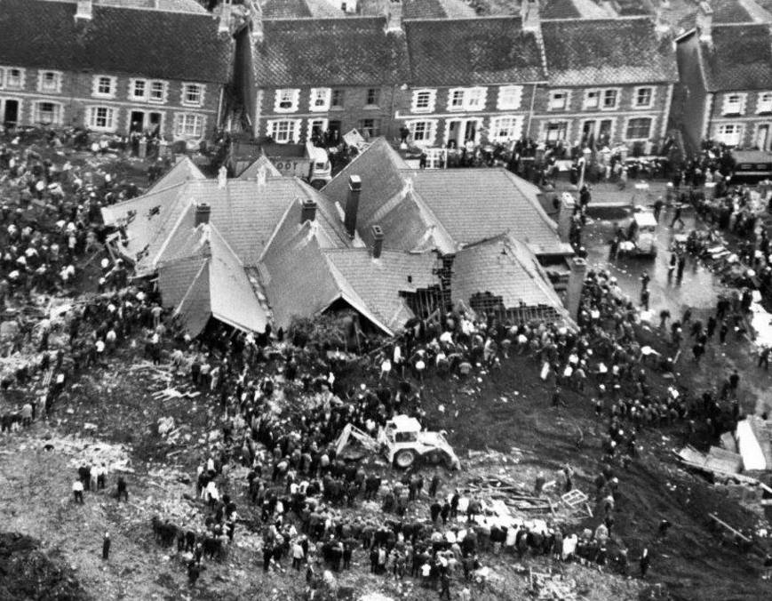 Rescuers searching through a demolished school after the Aberfan disaster