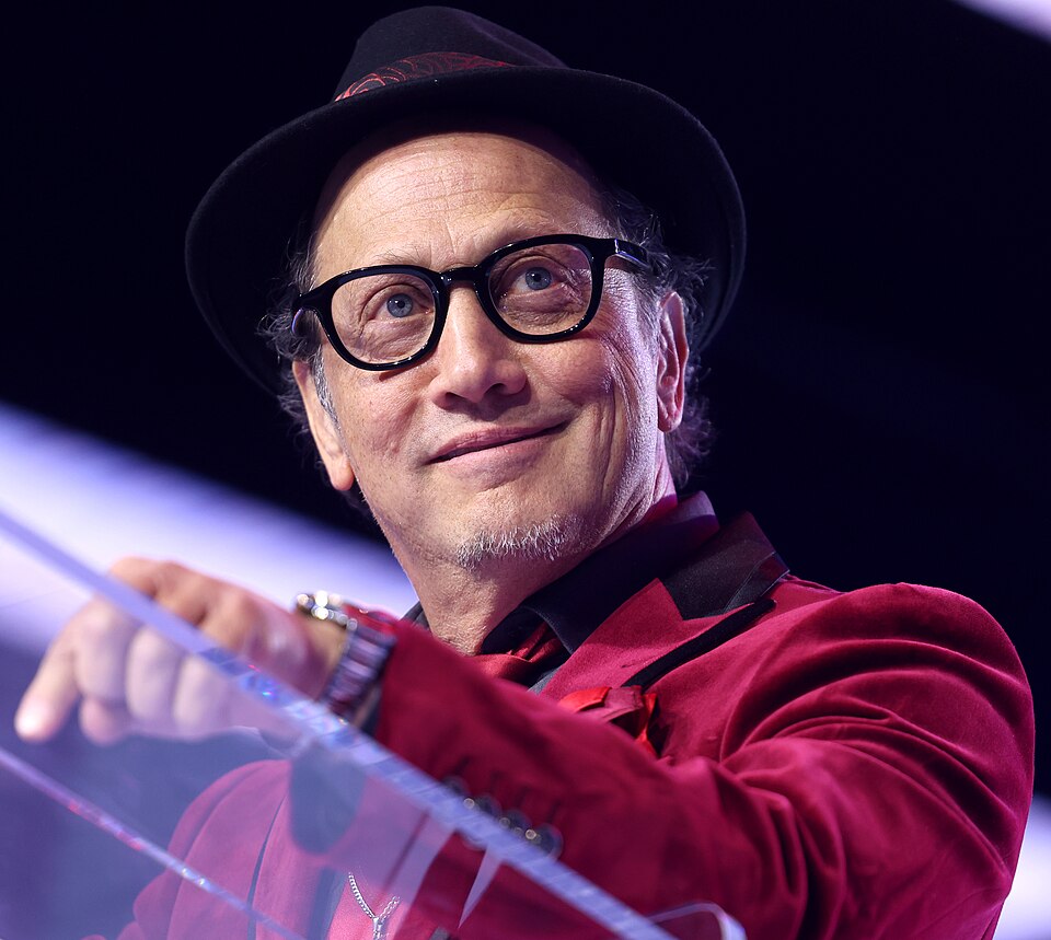 Rob Schneider speaking with attendees at the 2025 AmericaFest at the Phoenix Convention Center in Phoenix, Arizona.