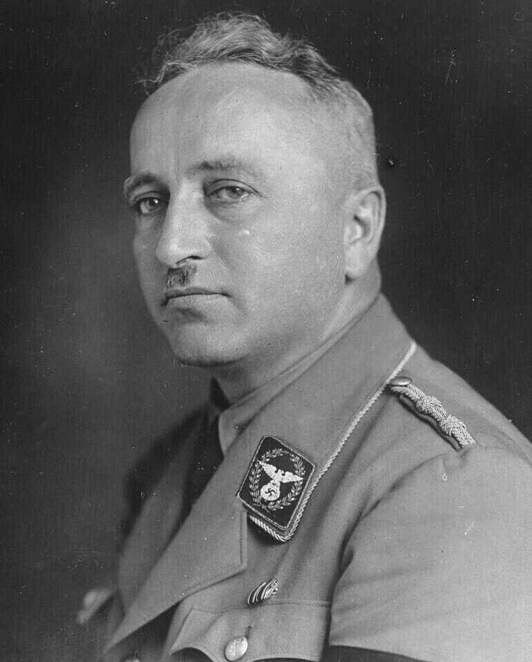Robert Ley , Nazi-Leader of the DAF ( German Labor Front ) & the KdF-program ( Strength through Joy ), wearing a mid-1930s Nazi Party jacket with braided…