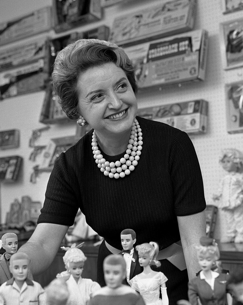 Ruth Handler, executive of Mattel Toy company, posing with collection of Barbie dolls, 1961 Original Caption: CAREER WOMAN--Mrs. Elliott Handler, executive…