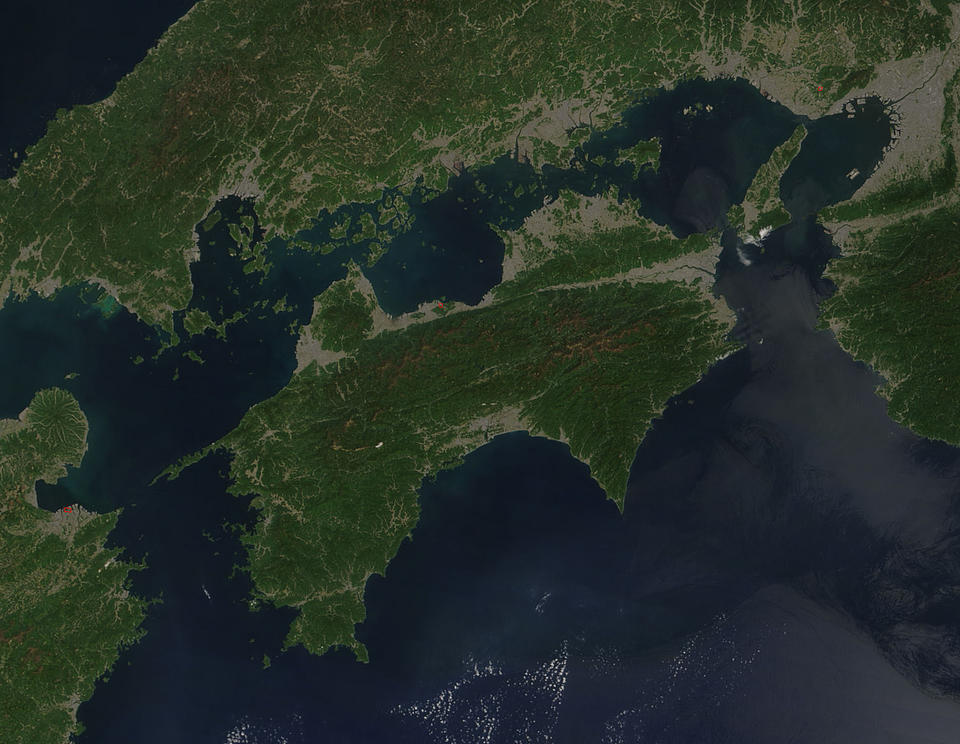 Satellite image of Shikoku on 21 April 2018. Each red hot spot is an area where the thermal bands on the MODIS instruments detected areas where the…