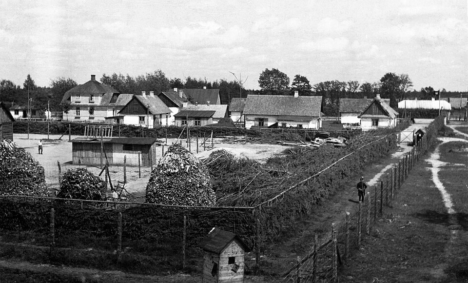 View of the camp in summer 1943. Retouched to remove artificial duotone, dust and scratches. "[T]he yard in the foreground is Lager I. It's a little hard to…