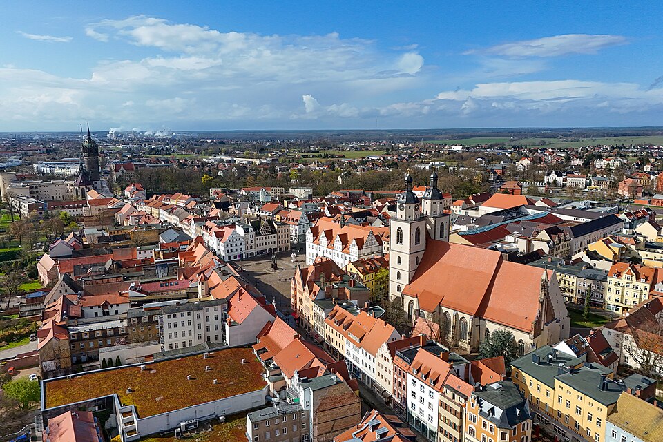 City center of Wittenberg with Stadtkirche (town church, right), market square, and Schlosskirche (castle church, background left)