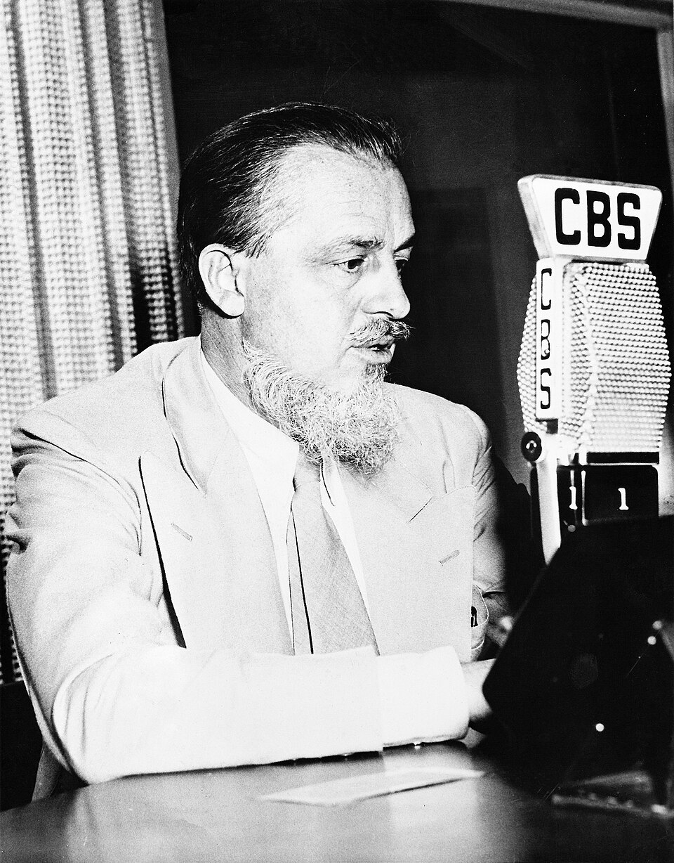 Promotional photo of Rex Stout , conducting the CBS Radio program Our Secret Weapon (1942–1943)