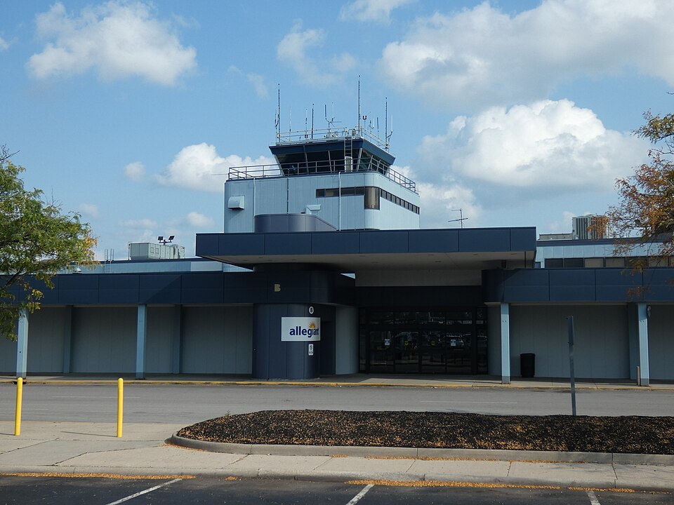 Photo showing the entrance to Terminal B with the control tower in the background. Taken at 11013 Airport Hwy, Swanton, Ohio.