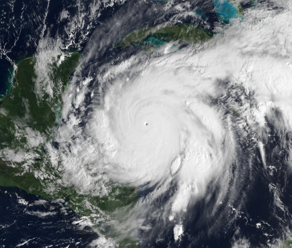 Composite image of Hurricane Wilma superimposing a visible satellite image of Wilma from GOES-12 taken at 13:45 UTC on October 19 (data from NOAA CLASS )…